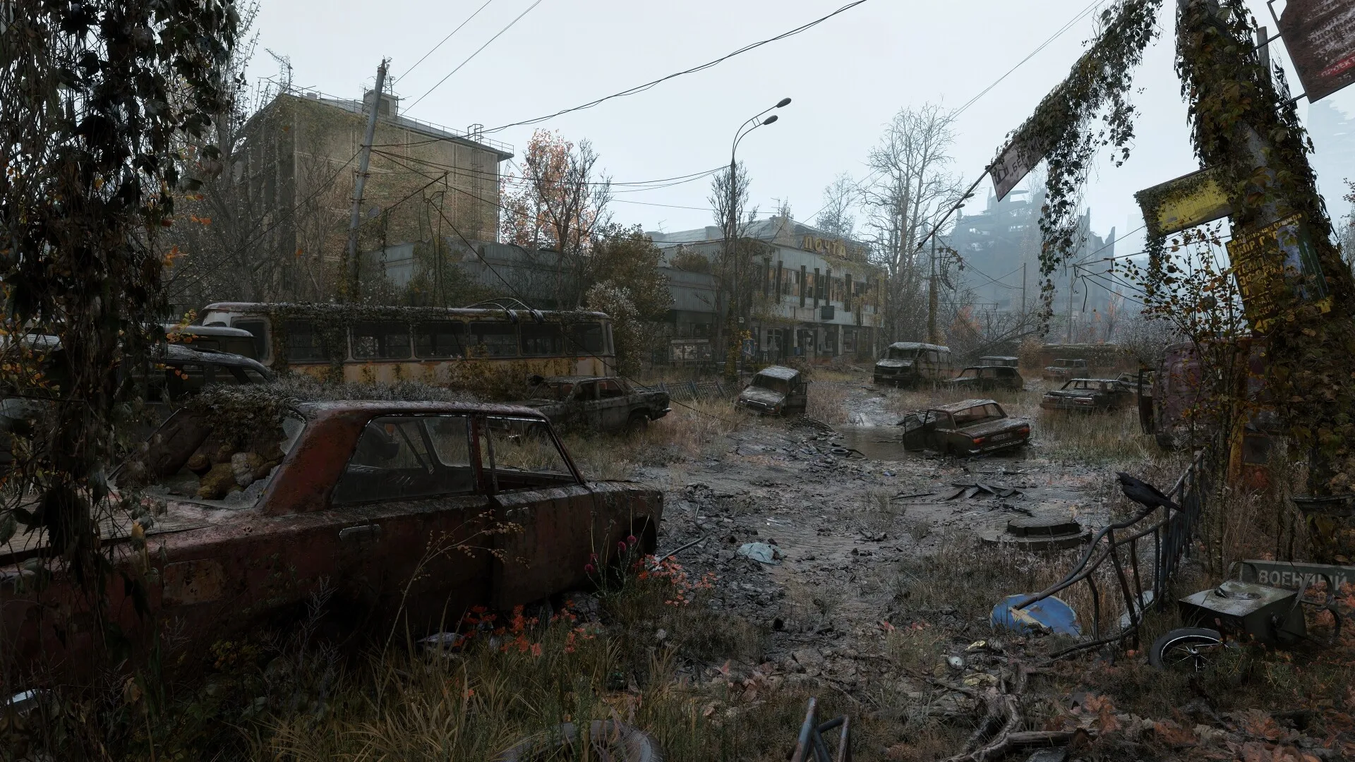 Overgrown street with an abandoned car